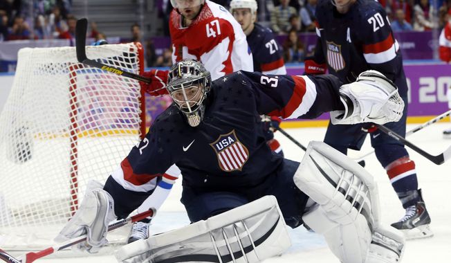 USA goaltender Jonathan Quick comes out of the crease to defend the goal in the third period of a men&#x27;s ice hockey game at the 2014 Winter Olympics, Saturday, Feb. 15, 2014, in Sochi, Russia. (AP Photo/Mark Humphrey)
