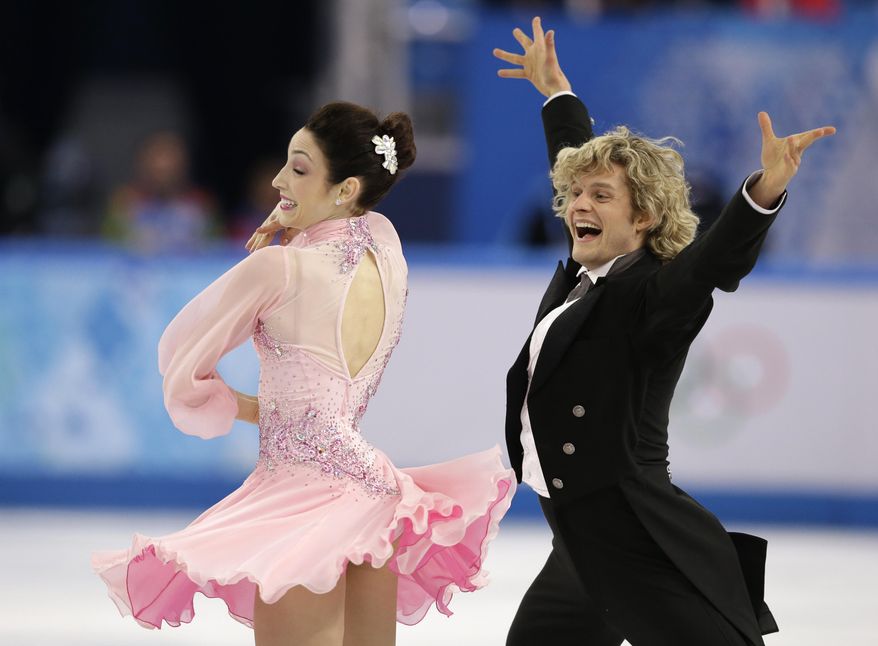 Meryl Davis and Charlie White of the United States compete in the ice dance short dance figure skating competition at the Iceberg Skating Palace during the 2014 Winter Olympics, Sunday, Feb. 16, 2014, in Sochi, Russia. (AP Photo/Darron Cummings)