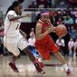 Arizona&#39;s Candice Warthen, right, drives the ball against Stanford&#39;s Lili Thompson during the first half of an NCAA college basketball game, Sunday, Feb. 16, 2014, in Stanford, Calif. (AP Photo/Ben Margot)