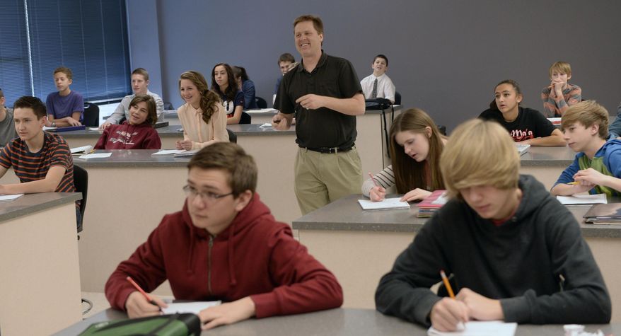 Ninth grade students in John Schneggenburger's biology class learn how to map pedigrees in genetics on Jan. 29, 2014 at Copper Mountain Middle School in Herriman, Utah. When lawmakers decided to boost per-pupil spending last year by 2 percent, many Utahns cheered, envisioning that cash raining on teachers and classrooms. In reality, much of that money was spoken for, by the state retirement system, long before it ever hit schools, a Salt Lake Tribune investigation has found. In the Salt Lake City and Alpine school districts, not one cent of the increased student funding made it into classrooms. All of it went to the state retirement system and/or rising health care costs. It's a pattern that could repeat this year unless lawmakers find more money per student than what's so far been proposed. (AP Photo/The Salt Lake Tribune, Al Hartmann)