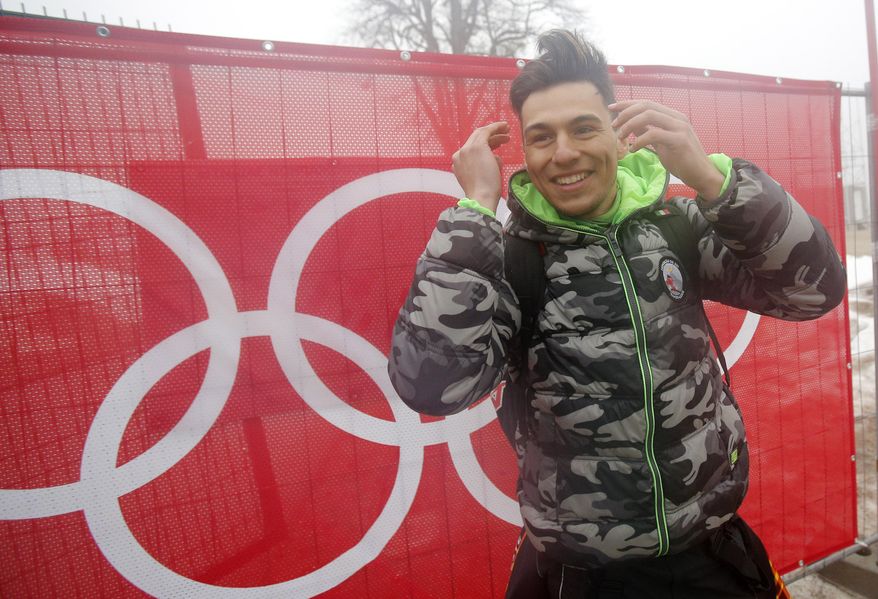 East Timor's Yohan Goncalves Goutt poses for a photo at the Sochi 2014 Winter Olympics, Monday, Feb. 17, 2014, in Krasnaya Polyana, Russia. Goncalves Goutt, 19, is preparing to compete as an Alpine skier in the Sochi Games, representing East Timor, whose officially recognized ski federation he founded. His race, the slalom, is Saturday night. (AP Photo/Christophe Ena)