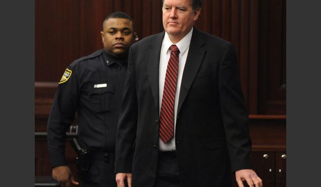 Defendant Michael Dunn is brought into the courtroom just before 5 p.m., where Judge Russell Healey announced that the jury was deadlocked on charge one and have verdicts on the other four charges as they deliberate in the trial of Dunn, Saturday, Feb. 15, 2014, for the shooting death of Jordan Davis in November 2012. Dunn is charged with fatally shooting 17-year-old Davis after an argument over loud music outside a Jacksonville convenient store. (AP Photo/The Florida Times-Union, Bob Mack, Pool)
