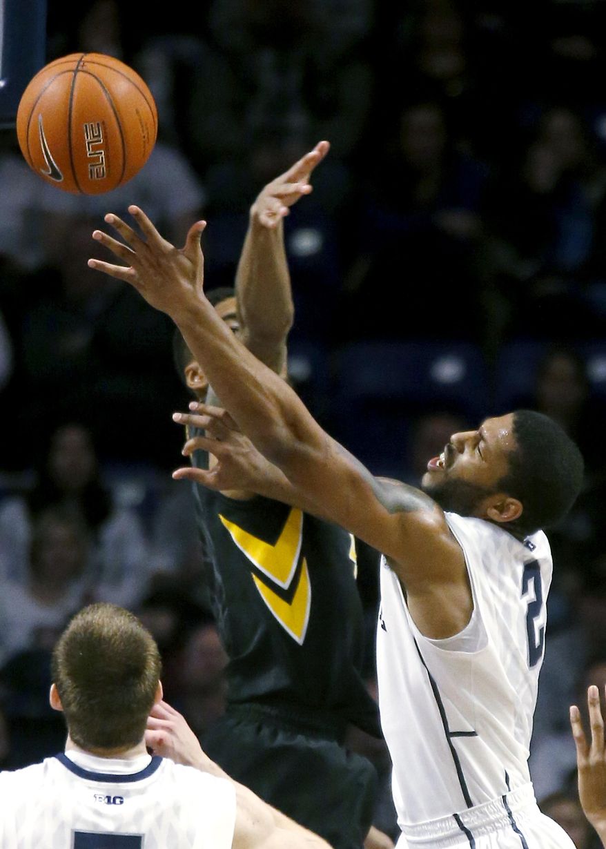 Penn State's D.J. Newbill, right, shoots around Iowa's Roy Devyn Marble during the second half of an NCAA college basketball game on Saturday, Feb. 15, 2014, in State College, Pa. Iowa won 82-70. (AP Photo/Keith Srakocic)