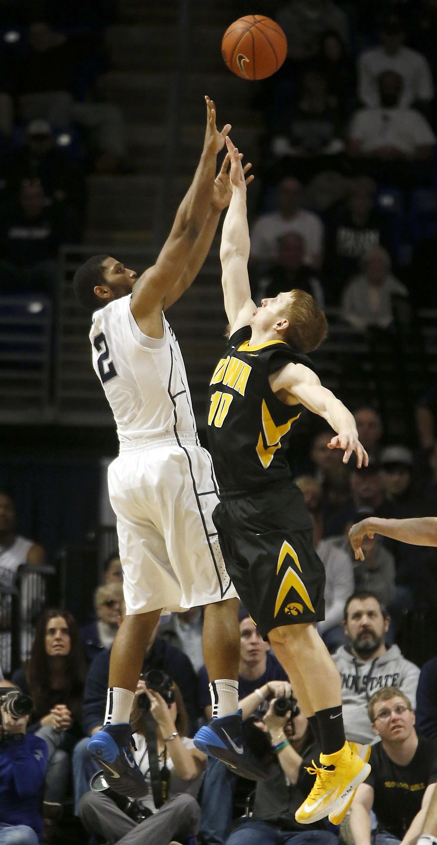 Penn State's D.J. Newbill (2) shoots over Iowa's Mike Gesell (10) during the second half of an NCAA college basketball game on Saturday, Feb. 15, 2014, in State College. Iowa won 82-70. (AP Photo/Keith Srakocic)
