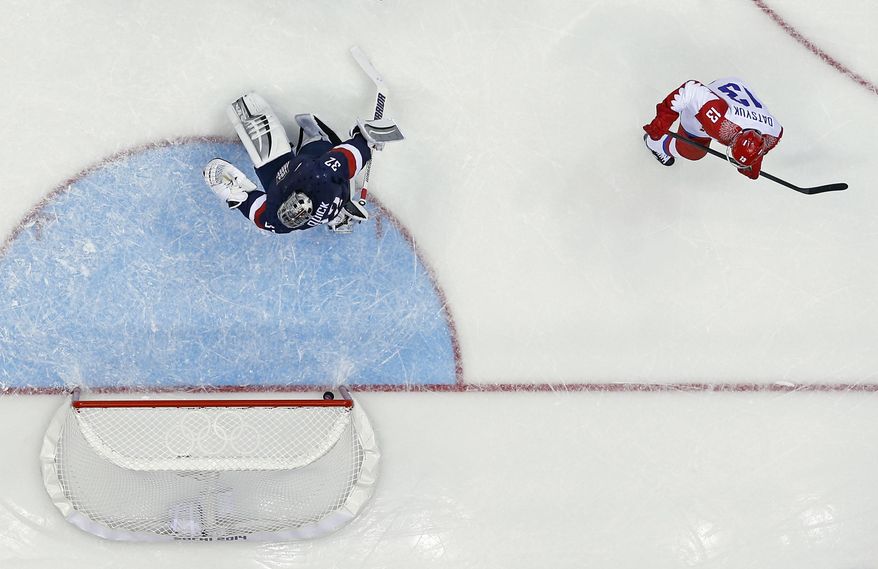 USA goaltender Jonathan Quick can't stop a goal by Russia forward Pavel Datsyuk during the second period of a men's ice hockey game at the 2014 Winter Olympics, Saturday, Feb. 15, 2014, in Sochi, Russia. (AP Photo/Julio Cortez )