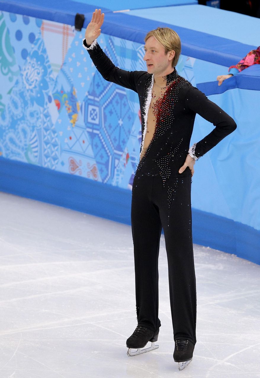 Evgeni Plushenko of Russia leaves the ice after pulling out of the men's short program figure skating competition due to illness at the Iceberg Skating Palace during the 2014 Winter Olympics, Thursday, Feb. 13, 2014, in Sochi, Russia. (AP Photo/Vadim Ghirda)