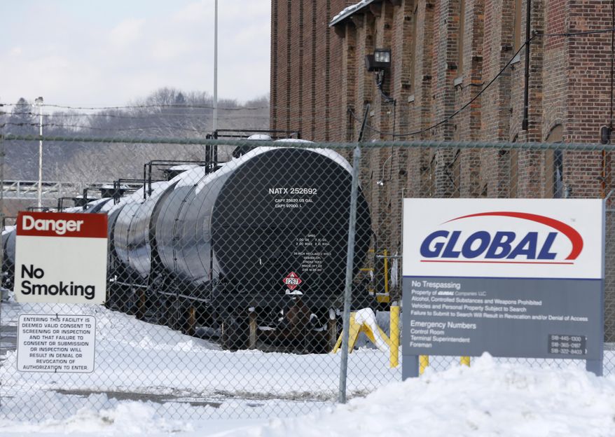 Railroad oil tanker cars are parked at a Global Partners building at the Port of Albany on Friday, Feb. 7, 2014, Albany, N.Y.The Port of Albany has become a hub for the U.S. oil business, taking shipments from North Dakota's Bakken Shale daily by mile-long trains and shipping it in tankers down the Hudson River to refineries. Opponents of a proposal to build boilers to liquefy heavy crude passing through Albany by rail are drawing attention to the capital’s emergence as a major hub for the transport of oil that’s widely considered risky from an environmental and safety standpoint. (AP Photo/Mike Groll)
