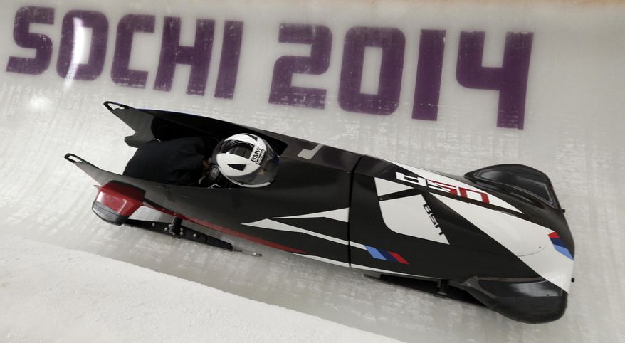 Elena Meyers and Katie Eberling of the United States take a turn during a training session for the women's bobsleigh at the 2014 Winter Olympics, Friday, Feb. 14, 2014, in Krasnaya Polyana, Russia. (AP Photo/Michael Sohn)