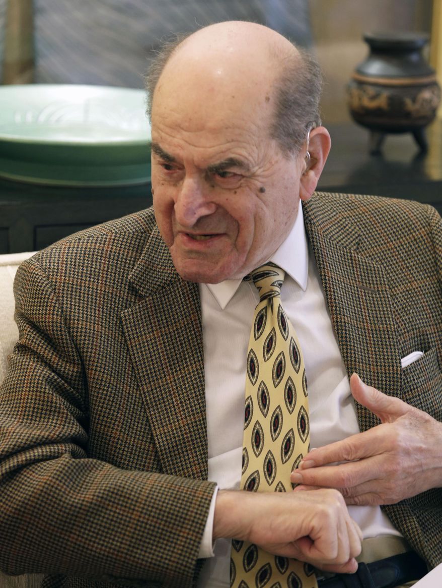 In this Wednesday, Feb. 5, 2014 photo, Dr. Henry Heimlich describes the maneuver he developed to help clear obstructions from the windpipes of choking victims, while being interviewed at his home in Cincinnati. Heimlich hopes his recently published memoir will preserve the technique that has made his name a household word. (AP Photo/Al Behrman)