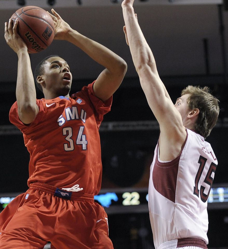 SMU's Ben Moore (34) shoots over Temple's Jimmy McDonnell during the first half of an NCAA college basketball game on Sunday, Feb. 16, 2014, in Philadelphia. (AP Photo/Michael Perez)