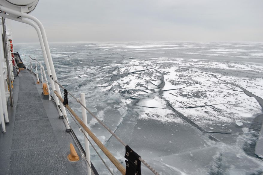 The Coast Guard Cutter Biscayne Bay, a 140-foot ice-breaking tug, sails the waters near Chicago and toward the shores off Indiana, Feb. 12, 2014. The Biscayne Bay helped break ice on the southern part of Lake Michigan to assist commerce. (Coast Guard photo by Chief Petty Officer Alan Haraf)