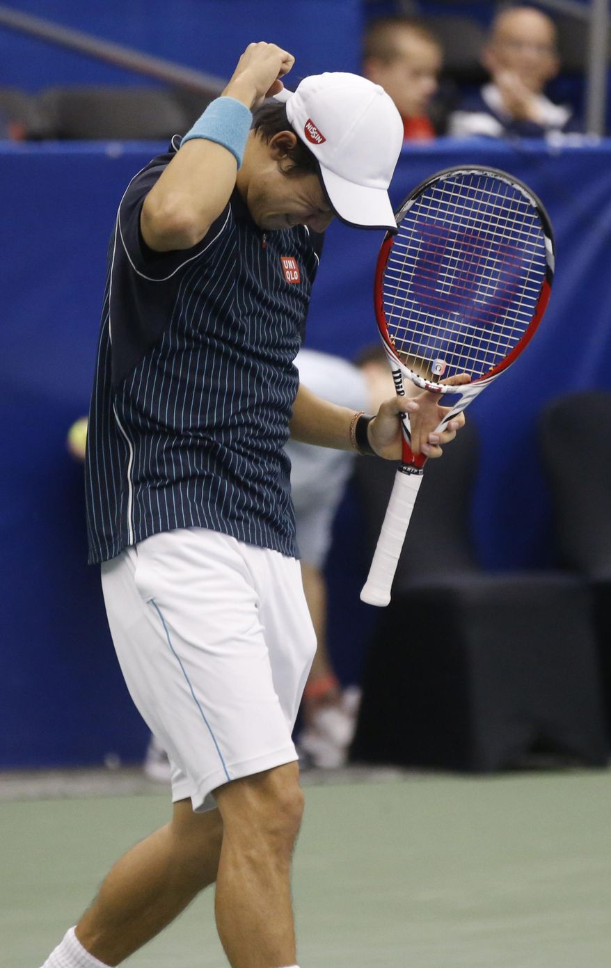 Kei Nishikori, of Japan, reacts after defeating Ivo Karlovic, of Croatia, in the singles final at the U.S. National Indoor Tennis Championships, Sunday, Feb. 16, 2014, in Memphis, Tenn. Nishikori won 6-4, 7-6 (0). (AP Photo/Rogelio V. Solis)