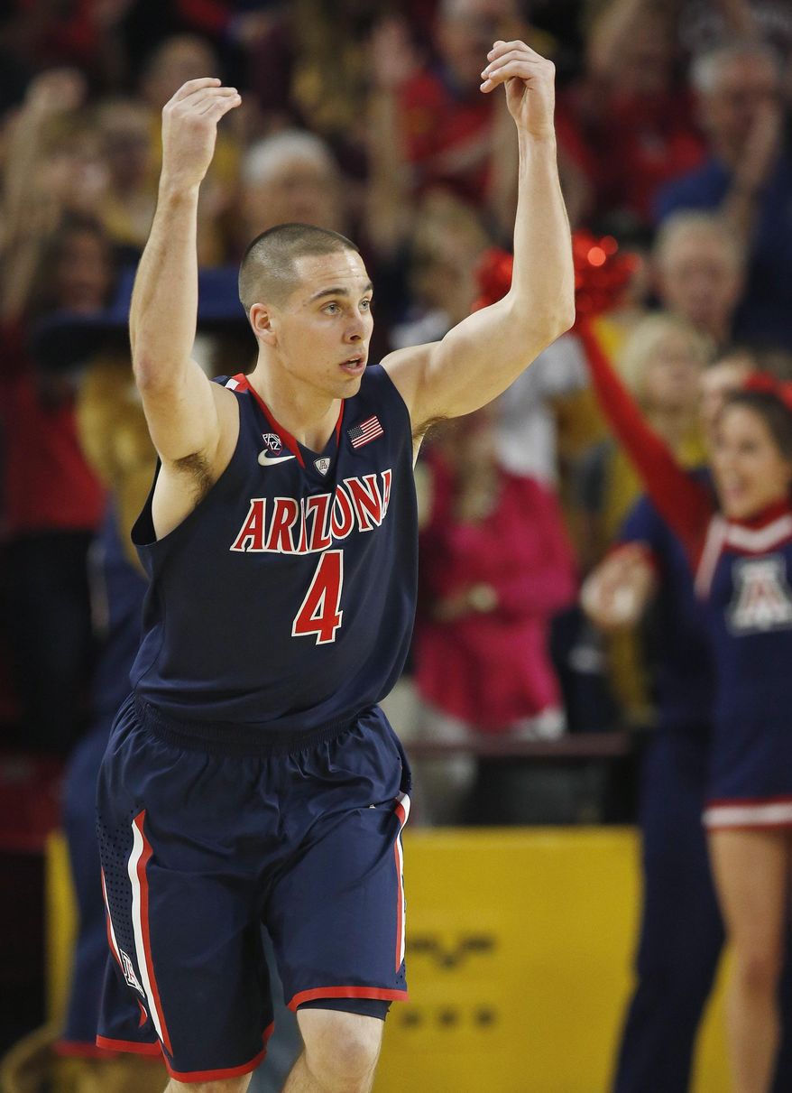 Arizona's T.J. McConnell celebrates a 3-point basket against Arizona State during the first half of an NCAA college basketball game on Friday, Feb. 14, 2014, in Tempe, Ariz. (AP Photo/Ross D. Franklin)