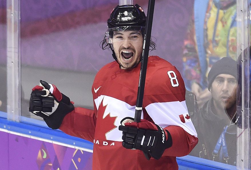 Canada defenseman Drew Doughty celebrates his goal against Finland during overtime in a men&#39;s ice hockey game at the Winter Olympics, Sunday, Feb. 16, 2014, in Sochi, Russia. (AP Photo/The Canadian Press, Nathan Denette)