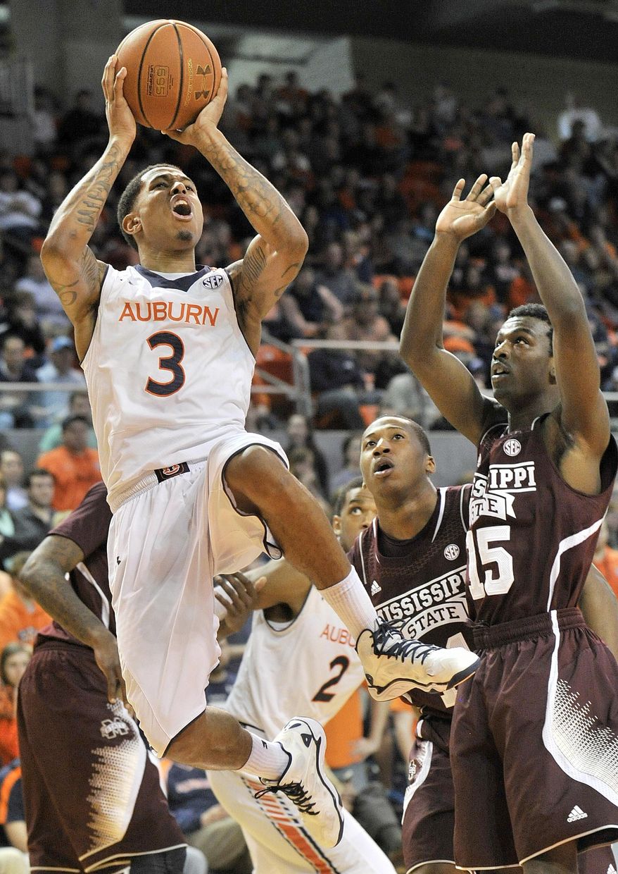 Auburn guard Chris Denson (3) scores against Mississippi State during an NCAA college basketball game Saturday, Feb. 15, 2014, at Auburn Arena in Auburn, Ala. (AP Photo/AL.com, Julie Bennett) MAGS OUT