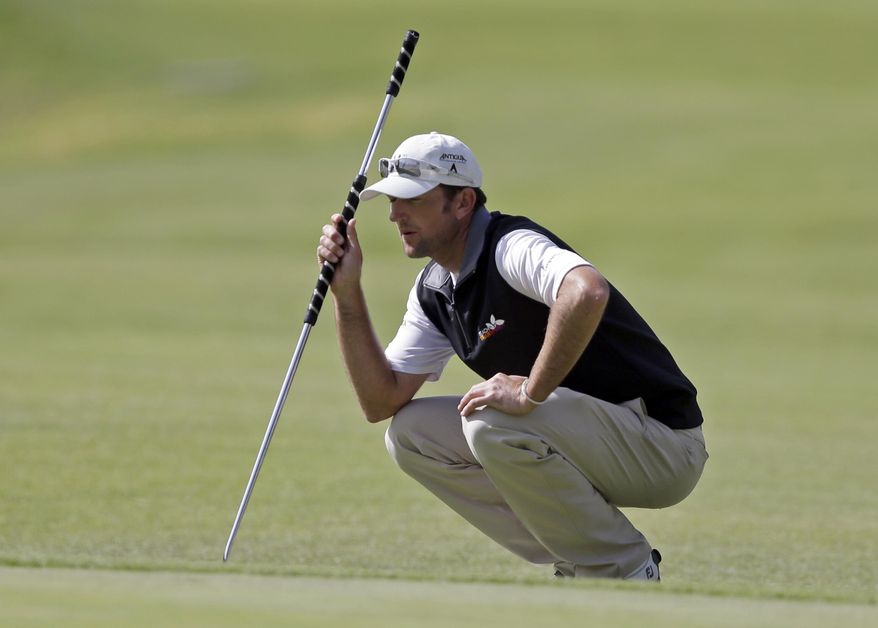 Jason Allred views his lie on the eighth green in the third round of the Northern Trust Open golf tournament at Riviera Country Club in the Pacific Palisades area of Los Angeles, Saturday, Feb. 15, 2014. (AP Photo/Reed Saxon)