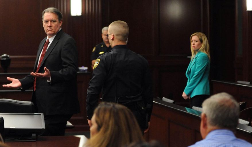 Michael Dunn reacts after the verdict is read in Jacksonville, Fla., Saturday, Feb. 15, 2014. Dunn was convicted of attempted murder in the shooting death of a teenager over an argument over loud music, but jurors could not agree on the most serious charge of first-degree murder. (The Florida Times-Union, Bob Mack, Pool)