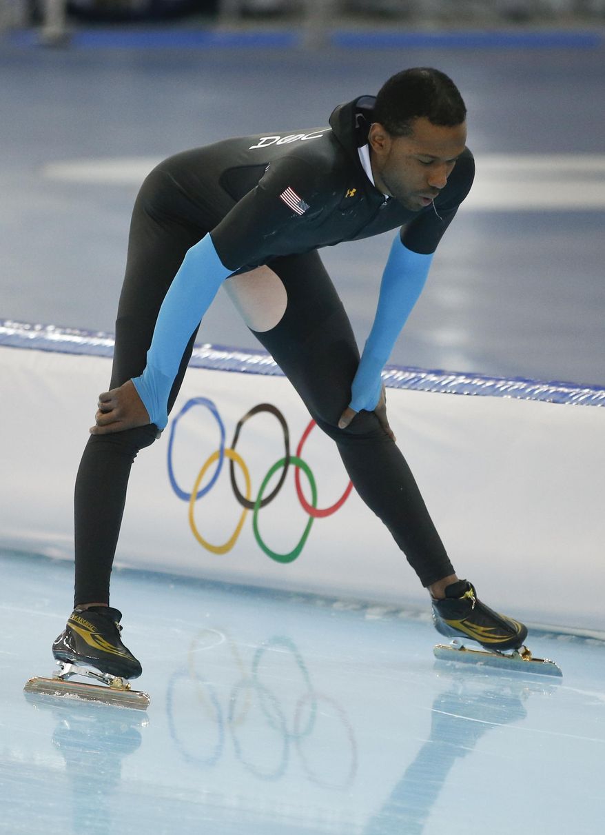 Speedskater Shani Davis of the U.S. practices at the Adler Arena Skating Center during the 2014 Winter Olympics, Monday, Feb. 17, 2014, in Sochi, Russia. (AP Photo/Pavel Golovkin)