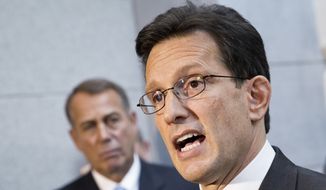 **FILE** House Majority Leader Eric Cantor, R-Va., with House GOP leaders, speaks with reporters following a Republican strategy session, at the Capitol in Washington, Tuesday, Oct. 15, 2013. At left is Speaker of the House John Boehner, R-Ohio.  (AP Photo/J. Scott Applewhite)