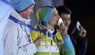 Medal winners in the men&#39;s normal hill nordic combined, from left, Norway&#39;s Magnus Krog, bronze, Germany&#39;s Eric Frenzel, gold, and Japan&#39;s Akito Watabe, silver, pose with their medals at the 2014 Winter Olympics in Sochi, Russia, Thursday, Feb. 13, 2014. (AP Photo/Morry Gash)