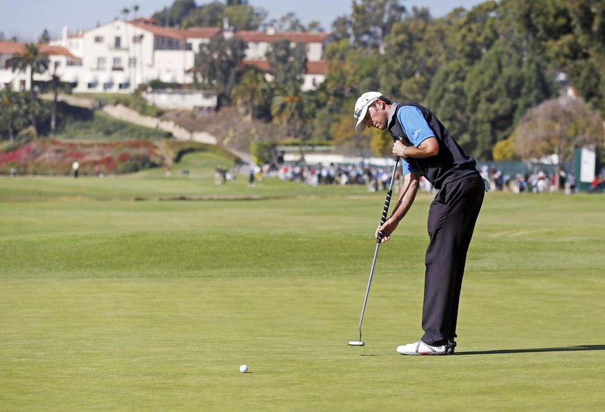 Jason Allred putts on the first green in the final round of the Northern Trust Open golf tournament at Riviera Country Club in the Pacific Palisades area of Los Angeles, Sunday, Feb. 16, 2014. Allred was a Monday qualifier and tied for third place in the final round Sunday. The tie for third was a career-best for the 33-year-old Allred. He earned $388,600, which is more than he had made in his entire career, which included two full seasons on the PGA Tour. (AP Photo/Reed Saxon)