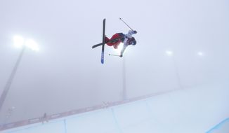 David Wise of the United States  jumps during a freestyle skiing training session in the halfpipe at the Rosa Khutor Extreme Park, at the 2014 Winter Olympics, Monday, Feb. 17, 2014, in Krasnaya Polyana, Russia. (AP Photo/Sergei Grits)