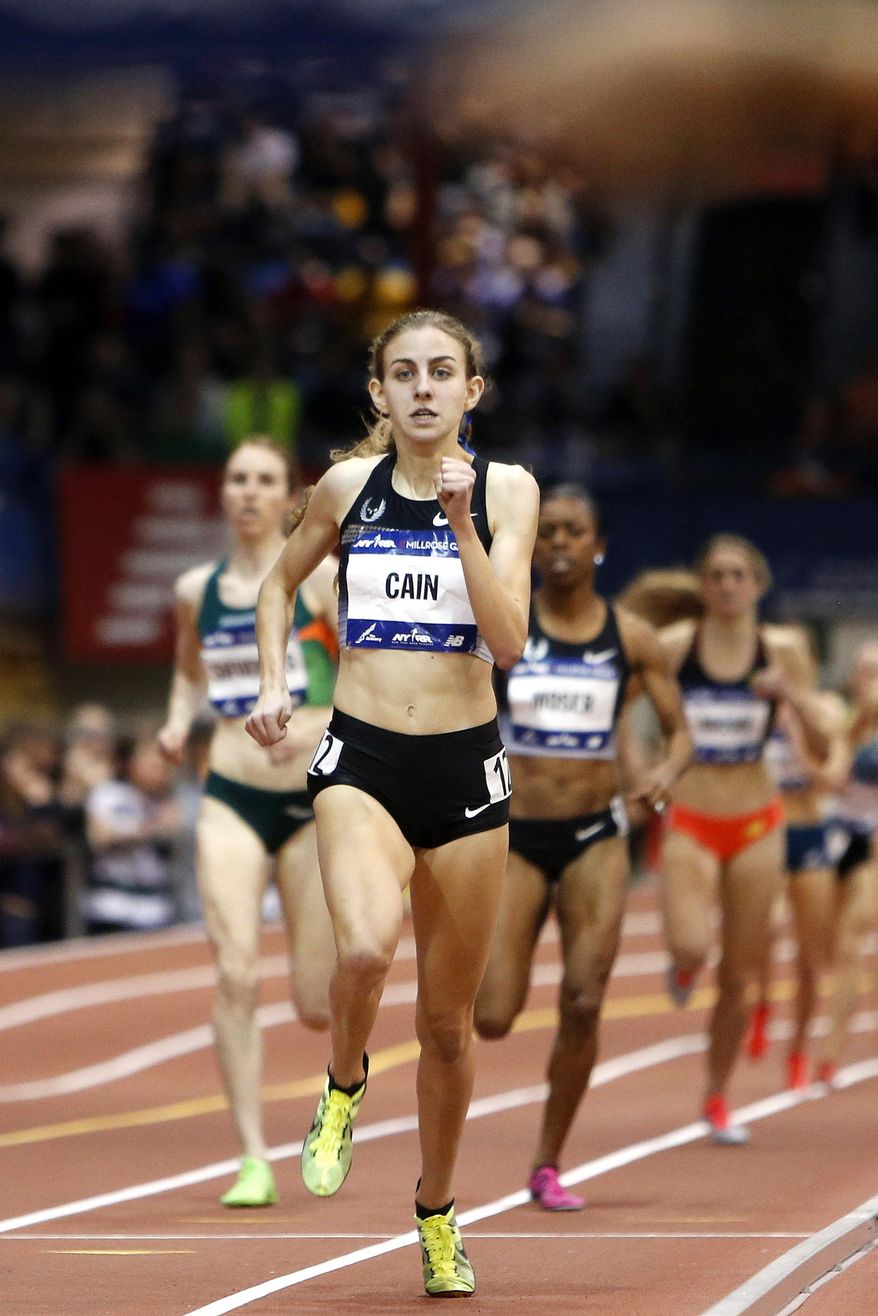 Mary Cain leads down the final stretch before winning the women's Wanamaker Mile during the Millrose Games, Saturday, Feb. 15, 2014, in New York. Cain won the event with a time of 4 minutes, 27.73 seconds. (AP Photo/Jason DeCrow)