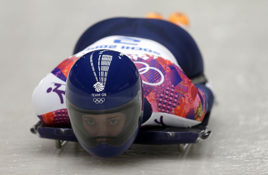 Elizabeth Yarnold of Great Britain starts her third run during the women's skeleton competition at the 2014 Winter Olympics, Friday, Feb. 14, 2014, in Krasnaya Polyana, Russia. (AP Photo/Natacha Pisarenko)
