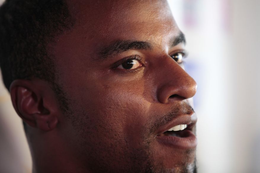 FILE - In this June 1, 2011, file photo, New Orleans Saints safety Darren Sharper speaks during a news conference in Metairie, La. The Los Angeles County district attorney's office says the former NFL player has been charged with drugging and raping two women. A district attorney's statement says Sharper will be arraigned Friday Feb. 14, 2014, on two counts of rape by use of drugs, four counts of furnishing a controlled substance and one count of possession of a controlled substance. (AP Photo/Gerald Herbert, File)