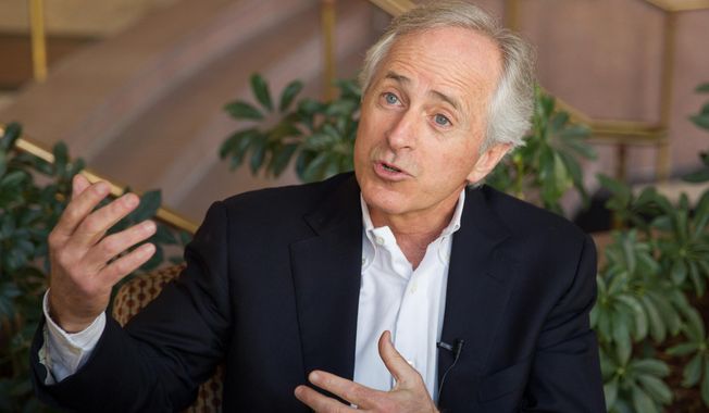 **FILE** Sen. Bob Corker, Tennessee Republican, speaks to reporters in Chattanooga on Feb. 15, 2014. (Associated Press)