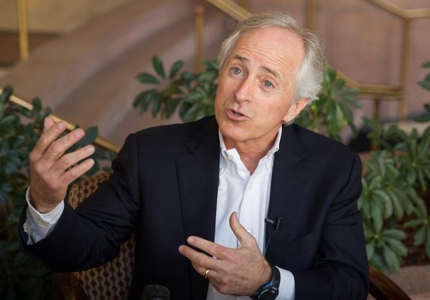**FILE** Sen. Bob Corker, Tennessee Republican, speaks to reporters in Chattanooga on Feb. 15, 2014. (Associated Press)