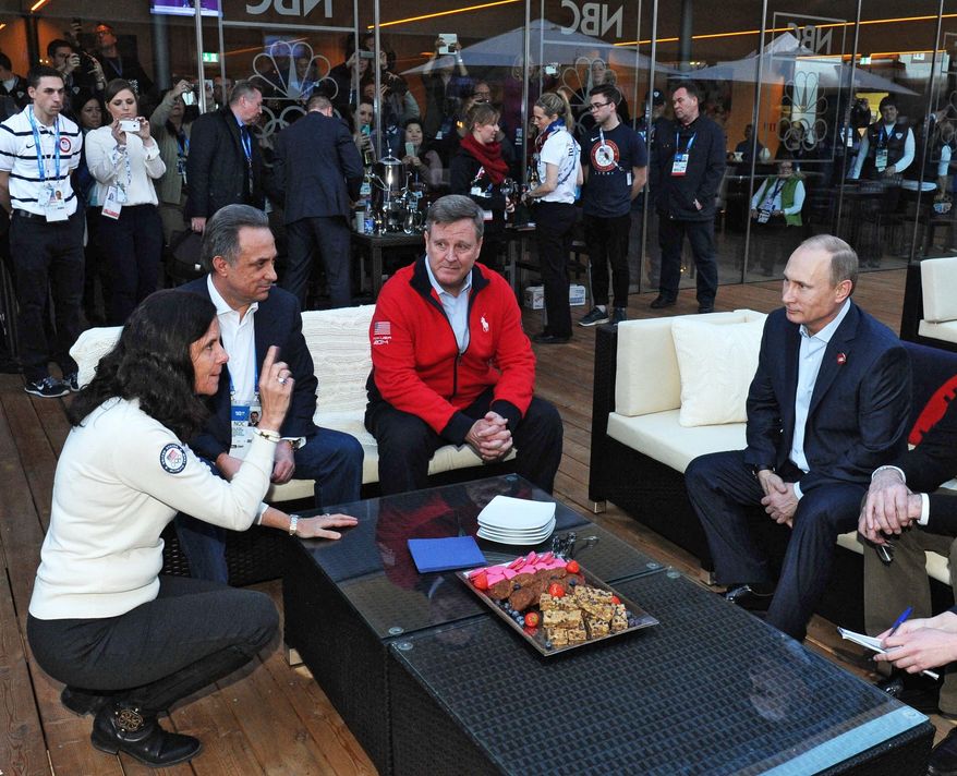CORRECTS SPELLING TO BLACKMUN INSTEAD OF BLACKMAN- Russian President Vladimir Putin, right, visits USA House during the 2014 Winter Olympics, Friday, Feb. 14, 2014 in Sochi, Russia. From left, US Olympic Committee official Lisa Baird, Russian Sports Minister Vitaly Mutko and Head of the United States National Olympic Committee Scott Blackmun. (AP Photo/RIA-Novosti, Mikhail Klimentyev, Presidential Press Service)