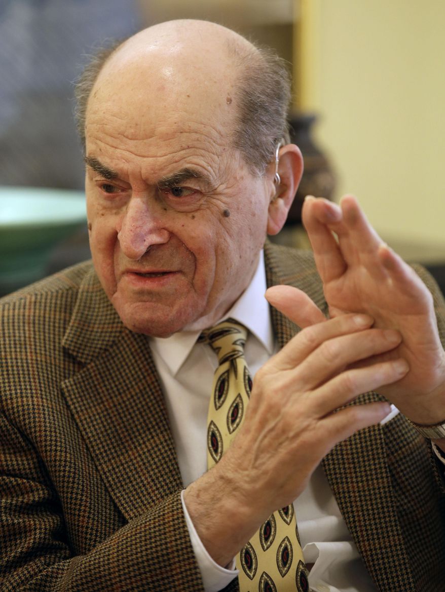 In this Wednesday, Feb. 5, 2014 photo, Dr. Henry Heimlich describes the maneuver he developed to help clear obstructions from the windpipes of choking victims, while being interviewed at his home in Cincinnati. Heimlich hopes his recently published memoir will preserve the technique that has made his name a household word. (AP Photo/Al Behrman)