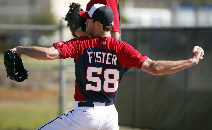 Washington Nationals pitcher Doug Fister throws during a spring training baseball workout, Monday, Feb. 17, 2014, in Viera, Fla. (AP Photo/Alex Brandon)