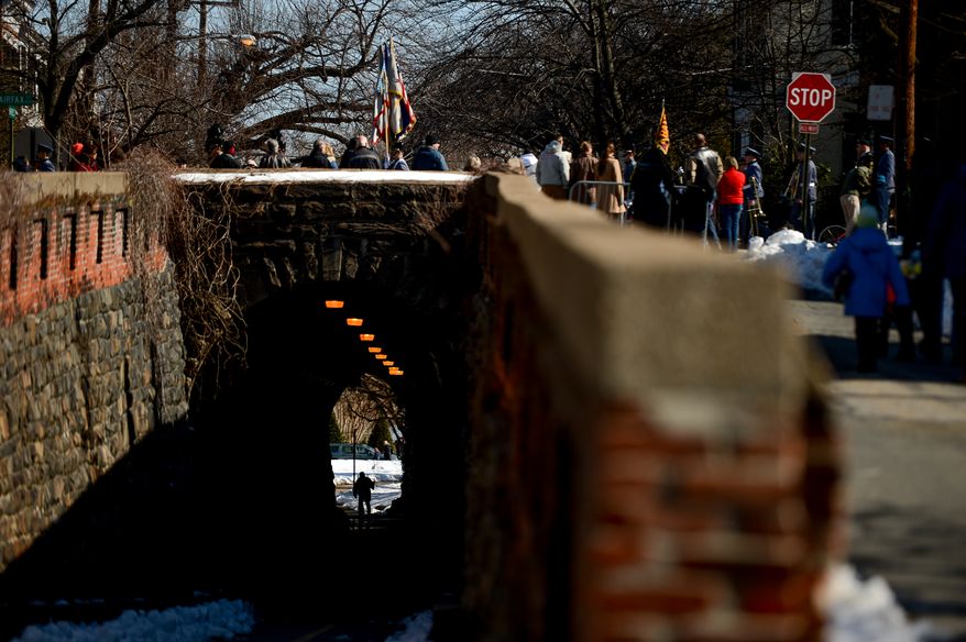 A man walks through a tunnel near the start of the annual Old Town Alexandria President's Day Parade, Alexandria, Va., Monday, February 17, 2014. (Andrew Harnik/The Washington Times)