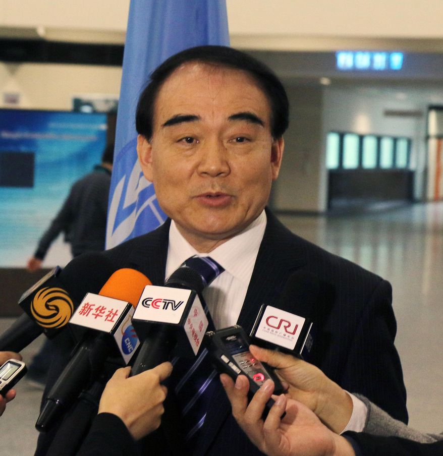Li Baodong China's Vice Minister of Foreign Affairs speaks to media during closed-door nuclear talks in Vienna, Austria, Tuesday, Feb. 18, 2014. Iran and six world powers are back at the negotiating table eager to come to terms on a comprehensive nuclear deal but deeply divided on what it should look like. The two sides began meeting Tuesday in attempts to build on a first-step accord that temporarily curbs Tehran's nuclear activities in exchange for some sanctions relief. (AP Photo/Ronald Zak)