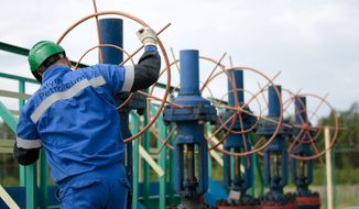 Pumped up: Salym Petroleum Development workers soon could be drilling for shale, or tight, oil. A venture between Gazprom Neft and Shell have announced plans to drill the first horizontal appraisal well in Russia. (Associated Press)