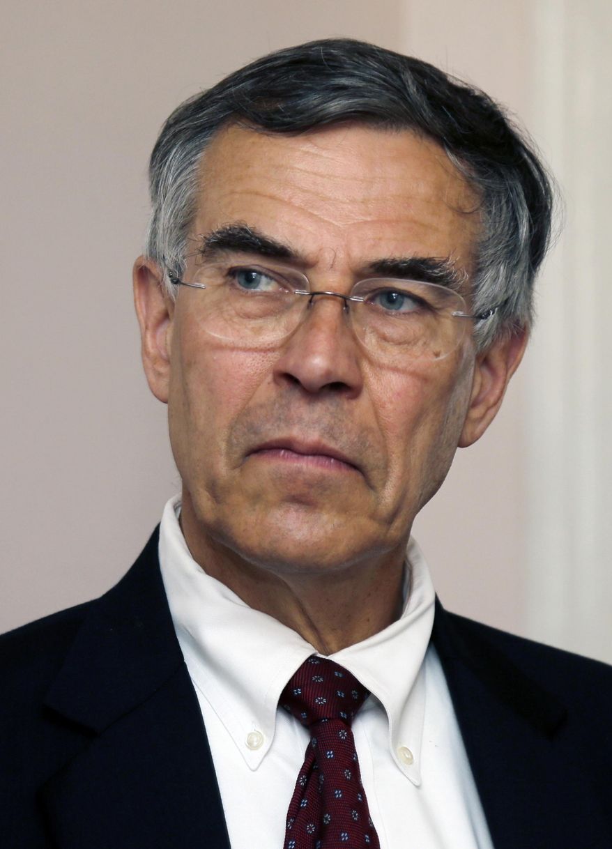 FILE In this Thursday, July 18, 2013 file photograph, U.S. Rep. Rush Holt listens to a question during a neighborhood meeting in a home in Trenton, N.J. On Tuesday, Feb. 18, 2014, Holt said he will not seek re-election in November and will retire from Congress when his term ends in January. The Democrat who represents central New Jersey's 12th District announced his decision with an email to constituents. (AP Photo/Mel Evans,file)