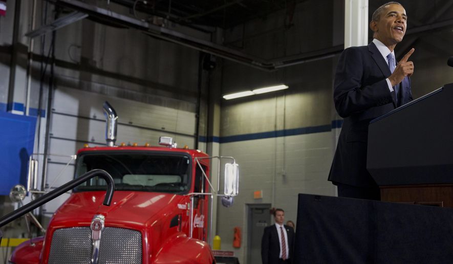 President Barack Obama speaks about how having a fuel-efficient truck fleet can boost the economy and help combat climate change, Tuesday, Feb. 18, 2014, at the Safeway Distribution Center in Upper Marlboro, Md. (AP Photo/Jacquelyn Martin)