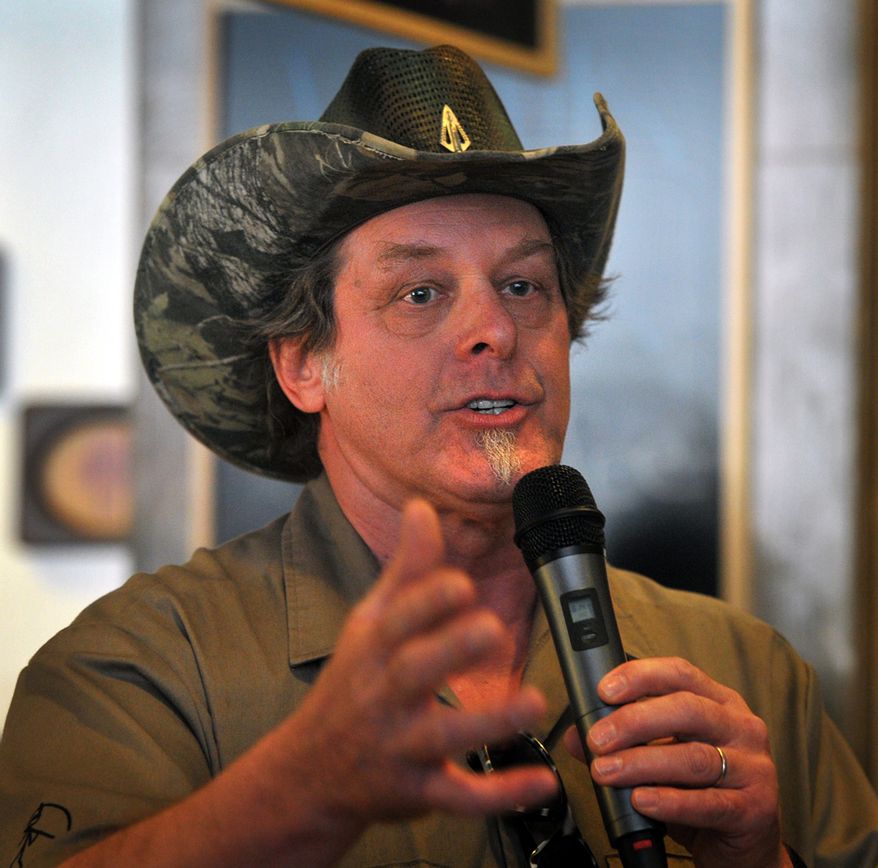 Longtime rocker Ted Nugent speaks to a crowd of Greg Abbott supporters during a campaign stop in Wichita Falls, Texas on Tuesday, Feb. 18, 2014. Abbott welcomed salty-tongued rocker Ted Nugent to his campaign for Texas governor on Tuesday but claimed ignorance about inflammatory remarks his polarizing surrogate has made on immigration and women. (AP Photo/Wichita Falls Times Record News, Torin Halsey)