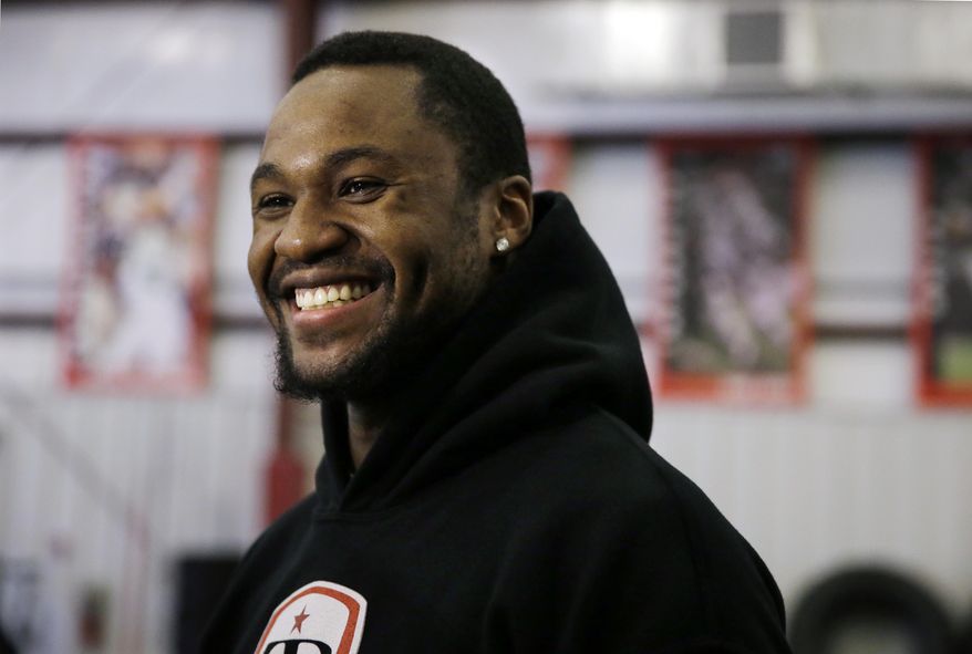 In this Feb. 14, 2014 photo, LSU wide receiver Kadron Boone smiles as he answers a question between training sessions at TEST Sports Clubs in Martinsville, N.J. College players from across the country come here to prepare for the NFL scouting combine in Indianapolis, the regional combines and their pro days. "The experience is something I can't explain," said Boone, who only saw snow once in his life before spending the past two months training in New Jersey. (AP Photo/Mel Evans)