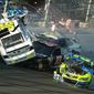 Parker Kligerman (30) gets airborne as he is involved in a crash with Ryan Truex (83), Paul Menard (27), and Dave Blaney (77) during practice for Sunday&#39;s NASCAR Daytona 500 Sprint Cup Series auto race at Daytona International Speedway, Wednesday, Feb. 19, 2014. (AP Photo/News-Journal, Nigel Cook)