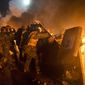 Anti-government protesters clash with riot police in Kiev&#39;s Independence Square, the epicenter of the country&#39;s current unrest,  Kiev, Ukraine, Tuesday, Feb. 18, 2014. Thousands of police armed with stun grenades and water cannons attacked a large opposition camp in Ukraine&#39;s capital on Tuesday that has been the center of nearly three months of anti-government protests after at least nine people were killed in street clashes. (AP Photo/Efrem Lukatsky)