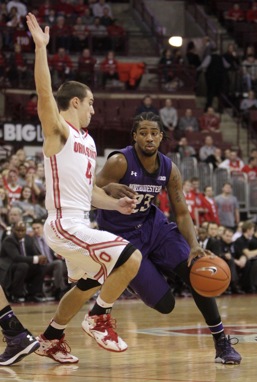 Northwestern's JerShon Cobb, right, drives the lane against Ohio State's Aaron Craft during the first half of an NCAA college basketball game Wednesday, Feb. 19, 2014, in Columbus, Ohio. (AP Photo/Jay LaPrete)