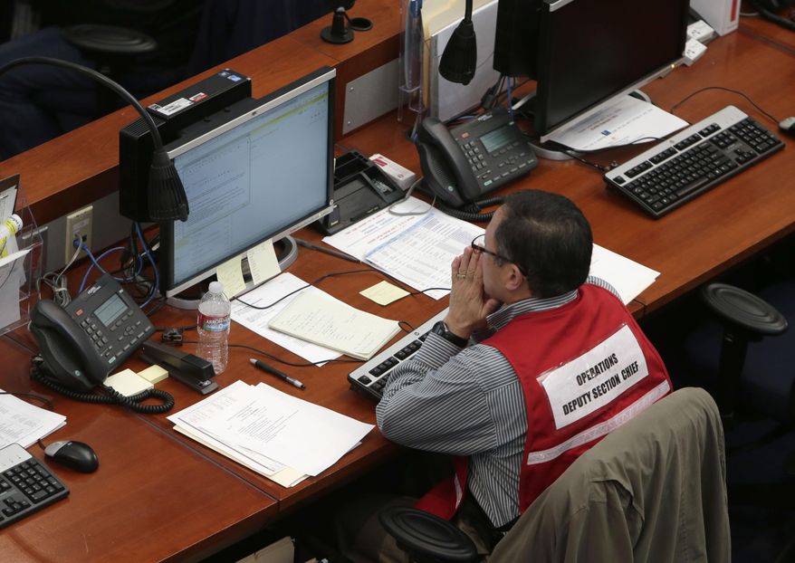 A staff member at the California Emergency Services State Operations Center studies the drought situation on a computer monitor at the facility in Mather, Calif., Wednesday, Feb. 19, 2014. California Gov. Jerry Brown, Senate President Pro Tem Darrell Steinberg, D-Sacramento, and Assembly Speaker John Perez, D-Los Angeles, toured the center where they announced a $687 million plan to provide immediate help to drought-stricken communities throughout California. (AP Photo/Rich Pedroncelli)