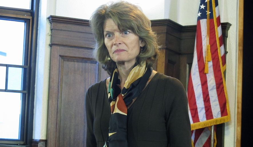 U.S. Sen. Lisa Murkowski addresses reporters during a news conference following her speech to a joint session of the Alaska Legislature on Wednesday, Feb. 19, 2014, in Juneau, Alaska. (AP Photo/Becky Bohrer)