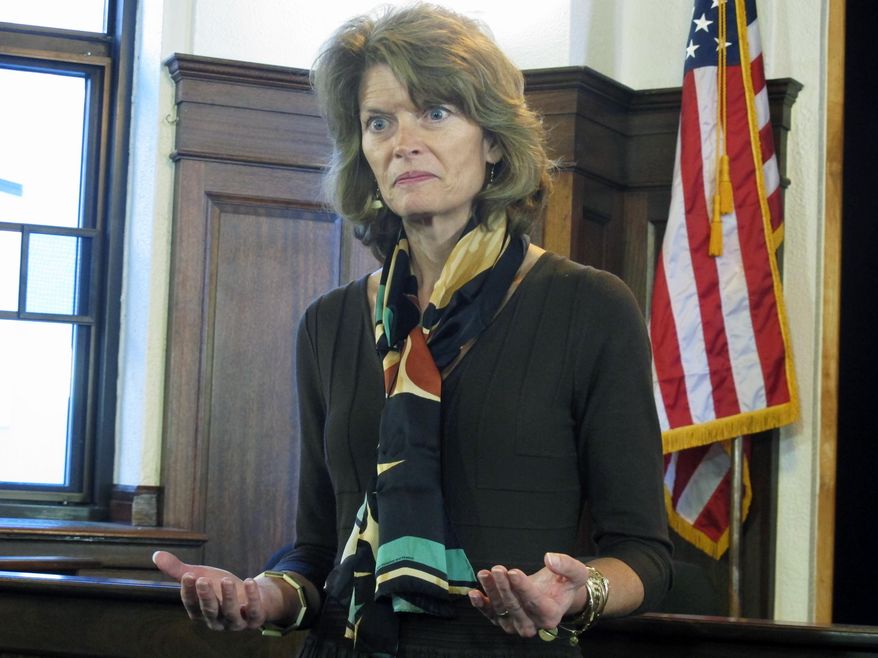 U.S. Sen. Lisa Murkowski addresses reporters during a news conference following her speech to a joint session of the Alaska Legislature on Wednesday, Feb. 19, 2014, in Juneau, Alaska. (AP Photo/Becky Bohrer)