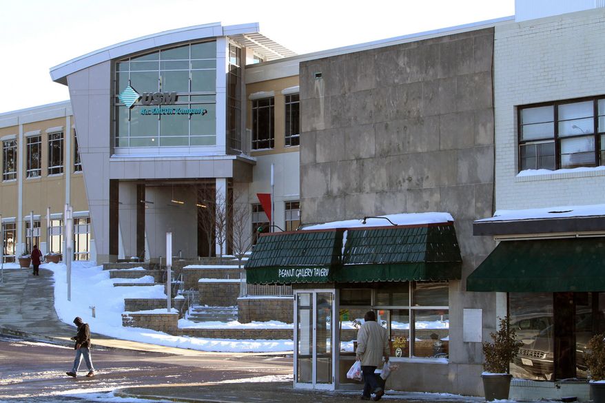 ADVANCE FOR USE SATURDAY, FEB, 22, 2014, AND THEREAFTER - In this Jan. 22, 2014 photo, people walk outside the headquarters of USM that is part of the Logan Square redevelopment project, also called Norristown Centre, in Norristown, Pa. The project has left Montgomery County on the hook for $25 million as it sits half-empty. (AP Photo/The Philadelphia Inquirer, Charles Fox) PHIX OUT; TV OUT; MAGS OUT; NEWARK OUT