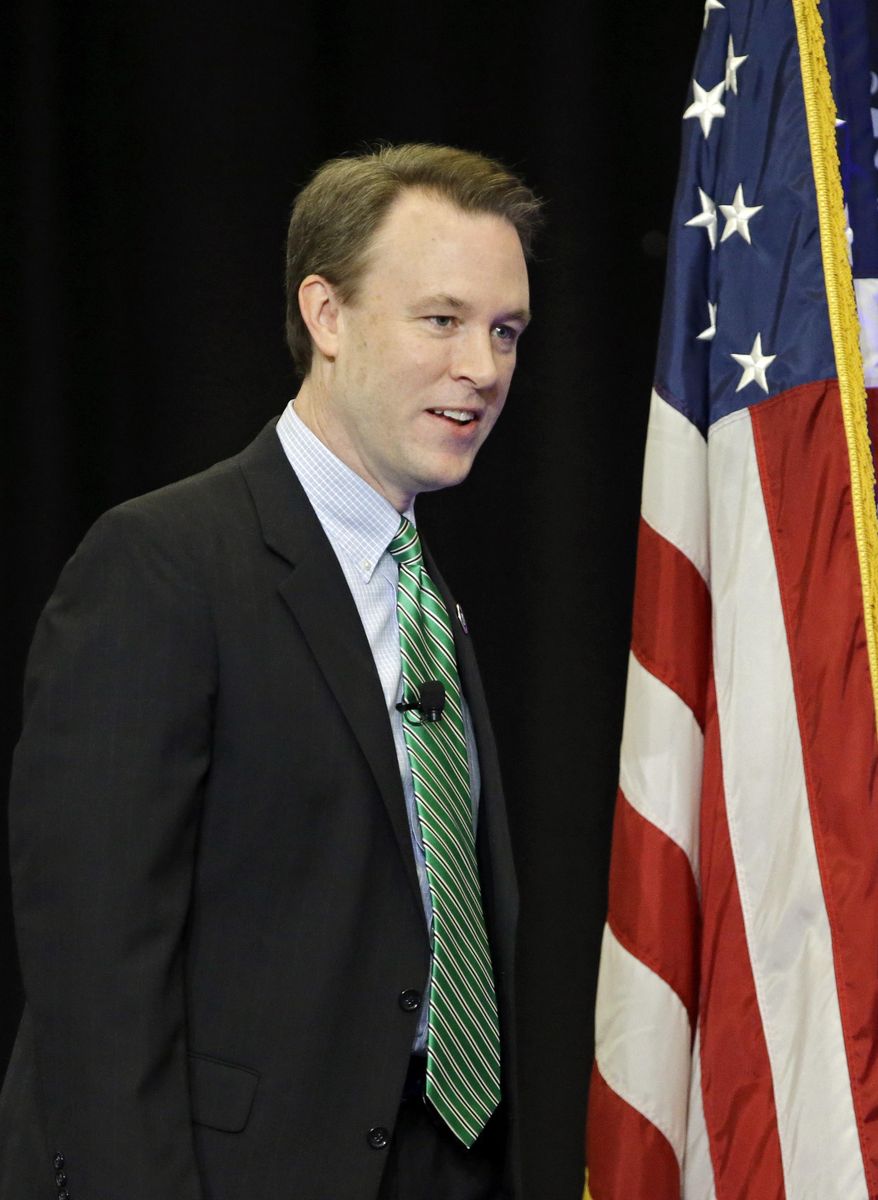 Democratic gubernatorial hopeful Cuyahoga County executive Ed FitzGerald takes the stage for his State of the County address in Cleveland Wednesday, Feb. 19, 2014. FitzGerald's speech came as a new Quinnipiac University poll showed Ohio incumbent Republican Gov. John Kasich leading FitzGerald 43 percent to 38 percent. (AP Photo/Mark Duncan)