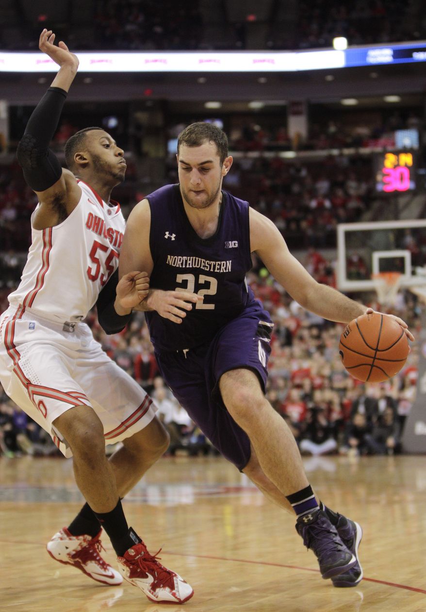 Northwestern's Alex Olah, right, drives to the basket against Ohio State's Trey McDonald during the first half of an NCAA college basketball game Wednesday, Feb. 19, 2014, in Columbus, Ohio. (AP Photo/Jay LaPrete)
